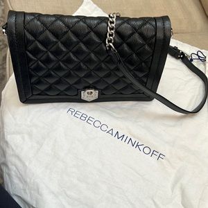 Black quilted Rebecca Mincoff crossbody bag.